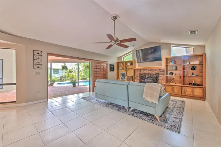 Family Room with Fireplace and Sliders to Lanai