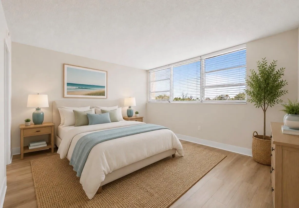 Spacious primary bedroom with walk in closet, ensuite bath and water views