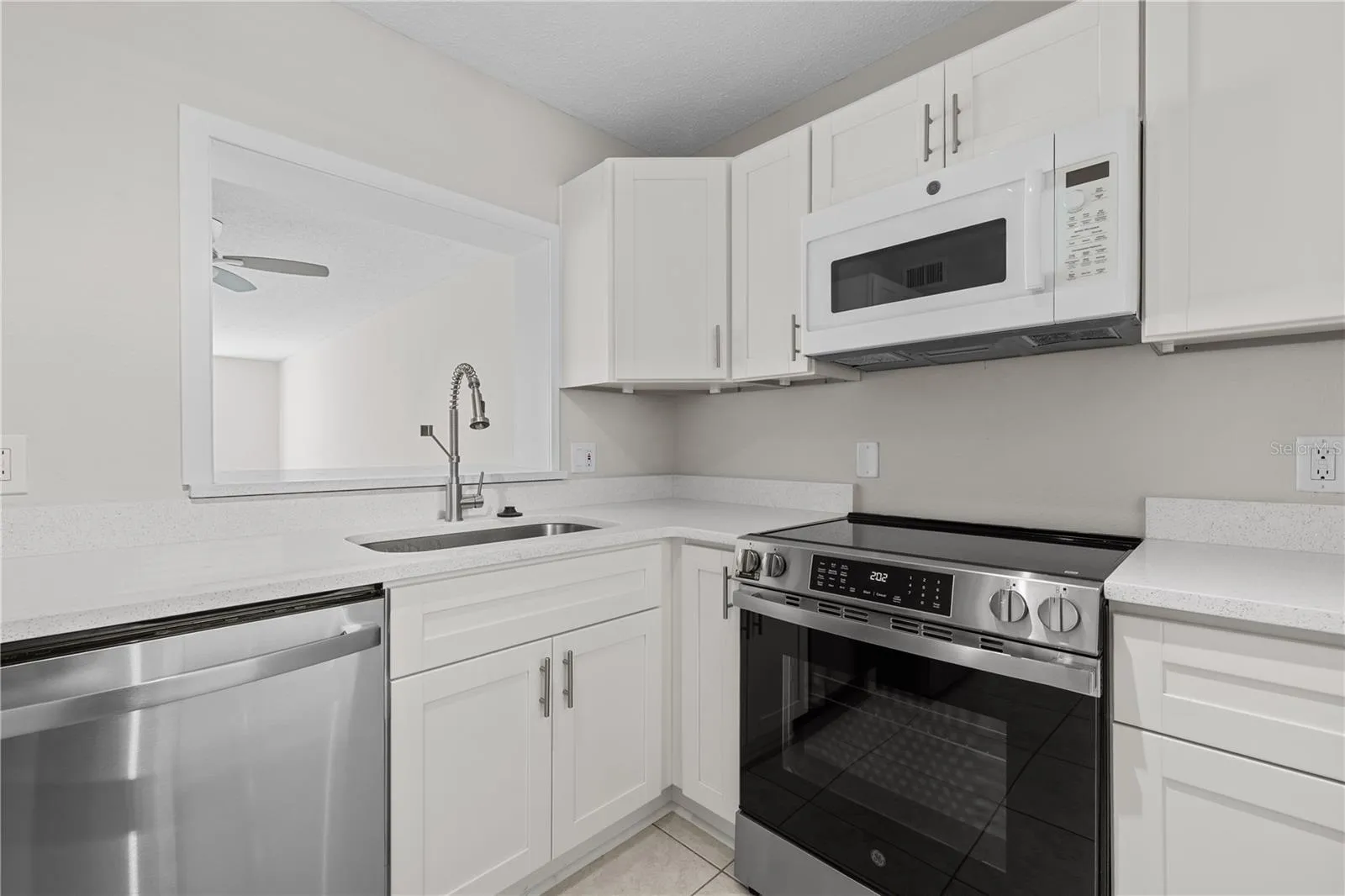 Newly renovated kitchen with white shaker cabinetry and Stainless Steel Appliances