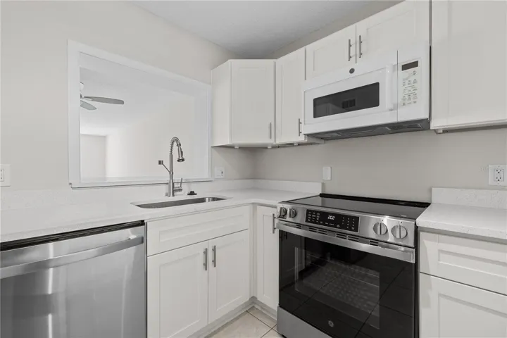 Newly renovated kitchen with white shaker cabinetry and Stainless Steel Appliances