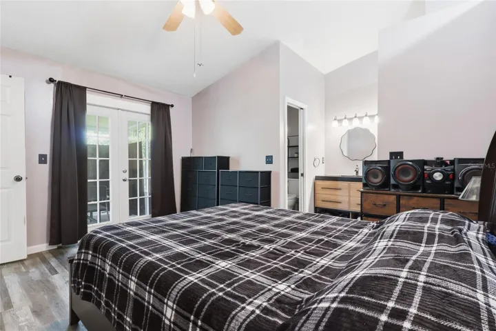 Primary bedroom with French doors to lanai