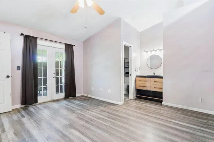 Primary Bedroom with French doors to lanai