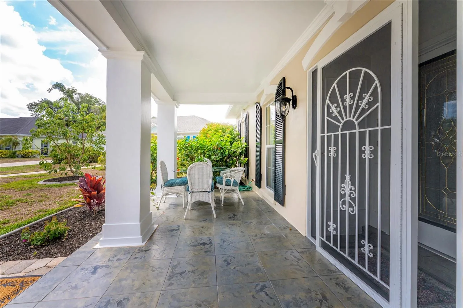 Charming Covered Front Porch.