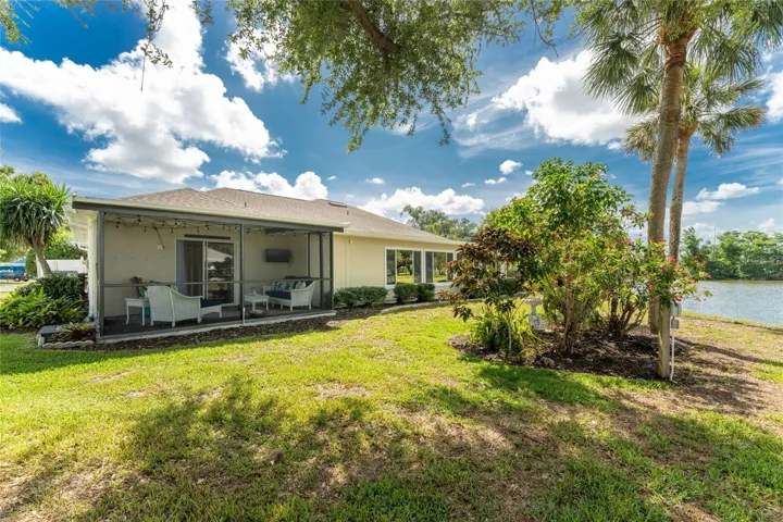 Rear of home showing screened lanai and beautiful view of the lake.