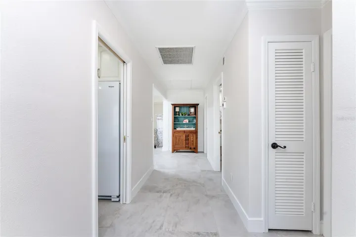 Spacious main hallway, boasts of clean lines, ample storage and a seamless flow into the heart of the home.