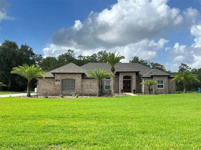 Welcome HOME to your POOL HOME set on ONE ACRE with 5 Bedrooms, 3 full Bathrooms, 3 Car Garage PLUS a detached 1 Car Garage, Hurricane Shutters and a FULL HOUSE GENERATOR!