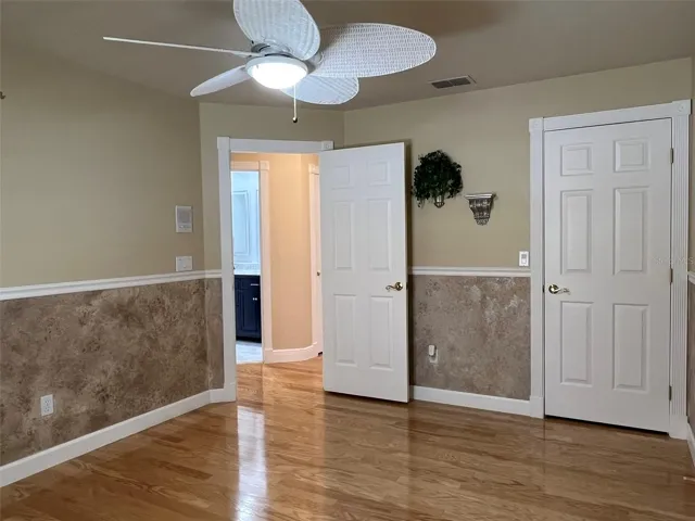 Bedroom 3:  This bedroom has access to the bathroom from the hall, has a ceiling fan, a closet and chair rail molding.