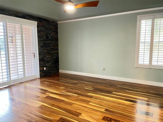 Primary bedroom has direct access to and a beautiful view of the pool.  You will find two sizeable closets already furnished with shelving to organize your clothes.