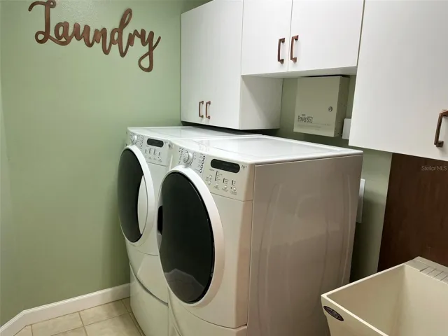 The Laundry Room has full size washer and dryer that stay with the home and it also has a laundry sink... great place to soak those stained clothes.