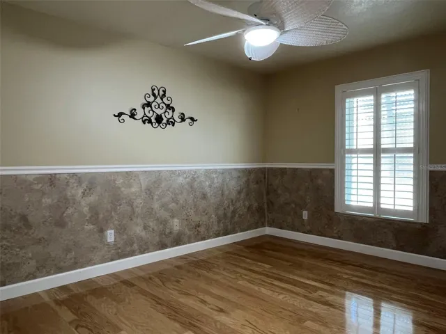 Bedroom 3:  This bedroom has access to the bathroom from the hall, has a ceiling fan, a closet and chair rail molding.