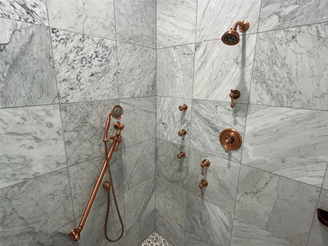 Shower head and a hand wand makes rinsing off a breeze.