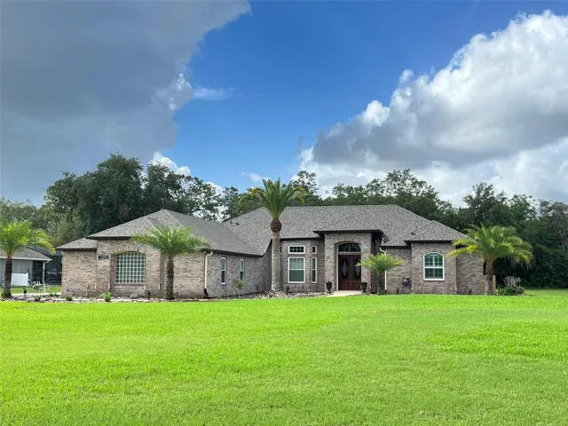 Welcome HOME to your POOL HOME set on ONE ACRE with 5 Bedrooms, 3 full Bathrooms, 3 Car Garage PLUS a detached 1 Car Garage, Hurricane Shutters and a FULL HOUSE GENERATOR!