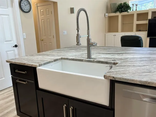 Love the apron front (farm style) sink with the commercial style pull down faucet.