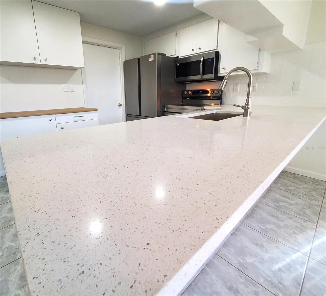large counter with new stainless steel sink