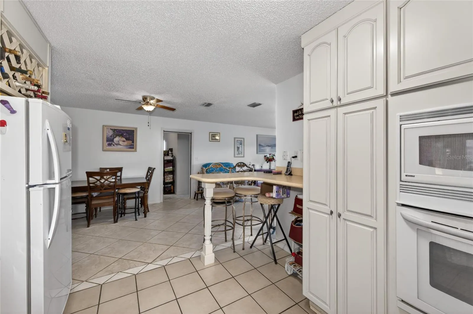 KITCHEN LOOKING INTO THE DINING SPACE