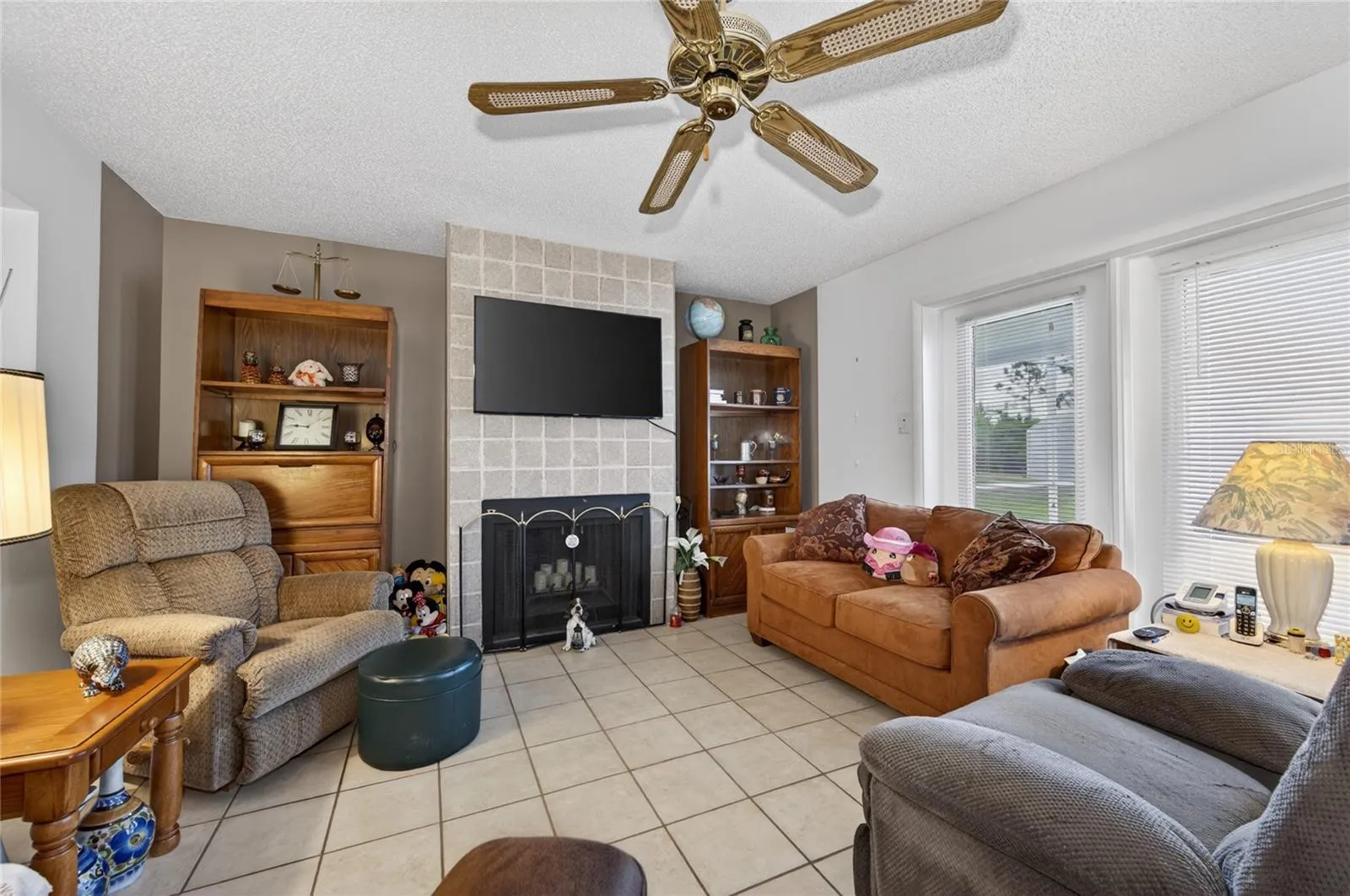INFORMAL LIVING ROOM WITH FIREPLACE