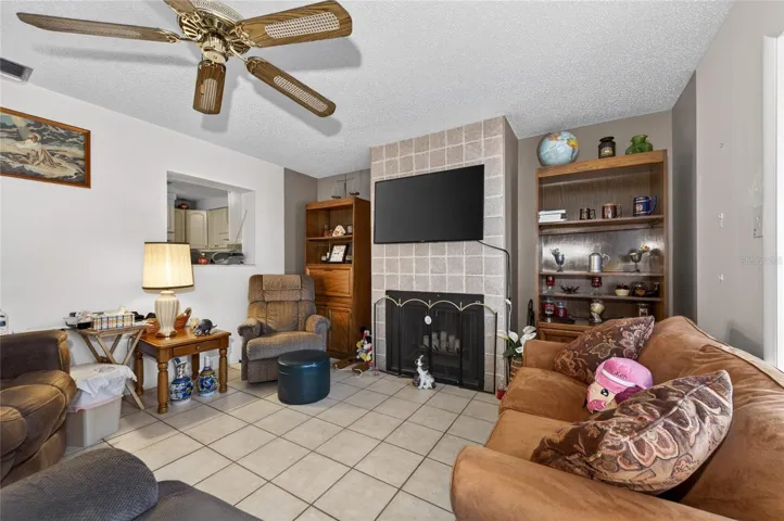 INFORMAL LIVING ROOM WITH FIREPLACE