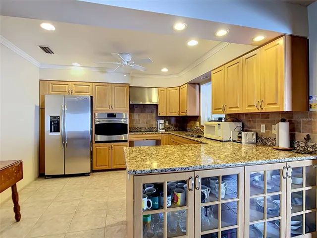 Bright and functional kitchen with oversized breakfast bar