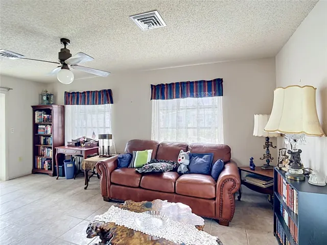 Comfortable family room with pool access nearby