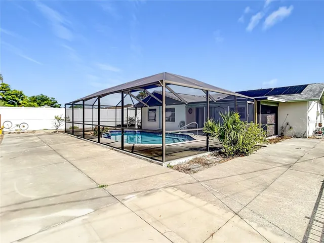 Expansive outdoor entertaining space with screened enclosure