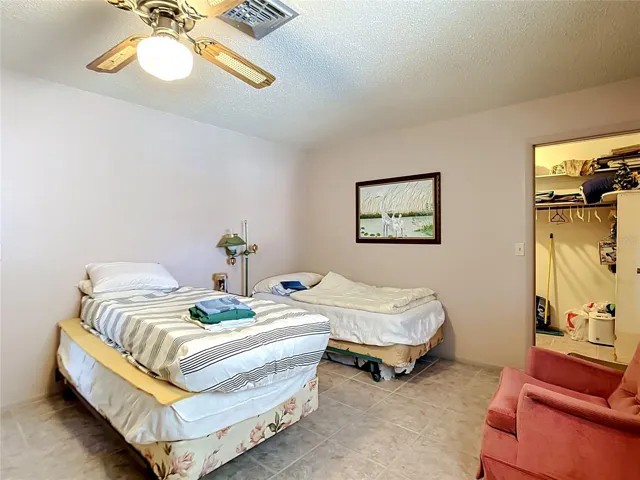 Guest bedroom with walk-in closet
