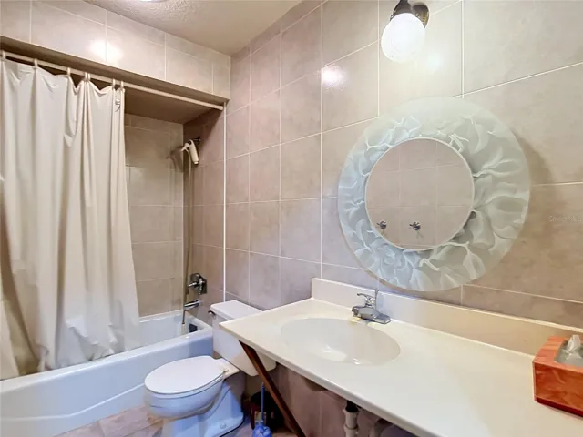 Guest bathroom with tub and shower combination