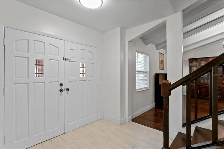 Welcoming foyer with ceramit tile flooring