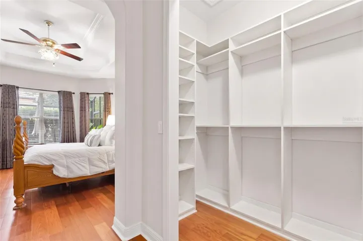 Virtually Staged-Primary Walk-in Custom Closet One