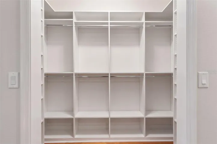 Virtually Staged-Primary Walk-in Closet One
