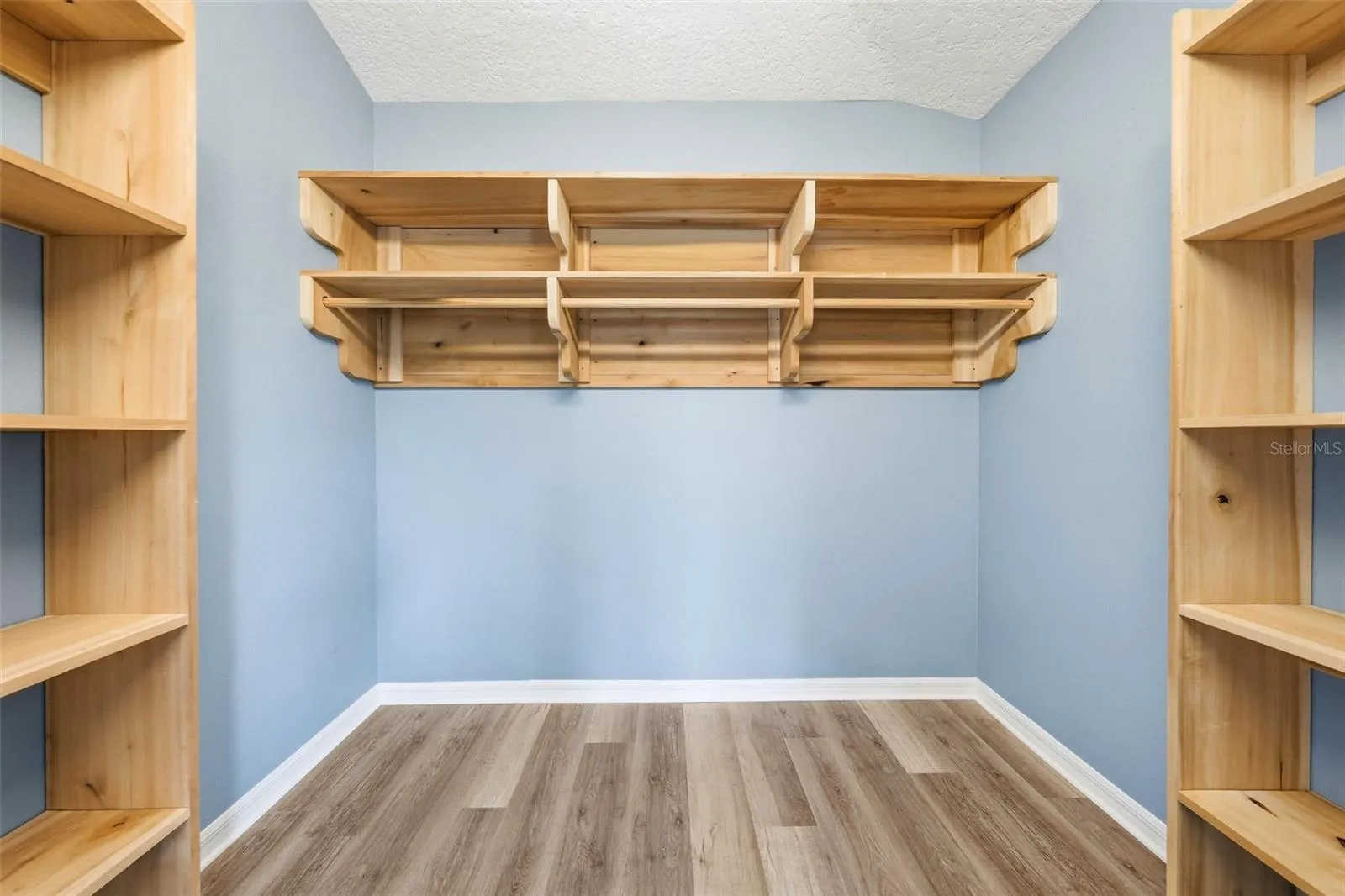 All closets feature custom Poplar or Red Oak wood finishes, adding warmth, character, and quality craftsmanship throughout the home.