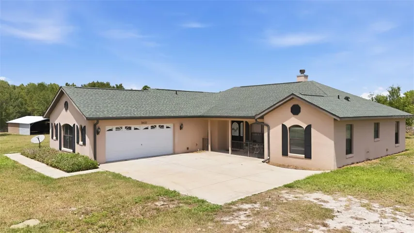 Tucked beneath the pines and surrounded by 14 beautiful acres, this private Lake Yale Road retreat offers room to breathe, dream, build, and unwind. A rare blend of country charm, wide-open space, and endless possibilities awaits beyond the gate.