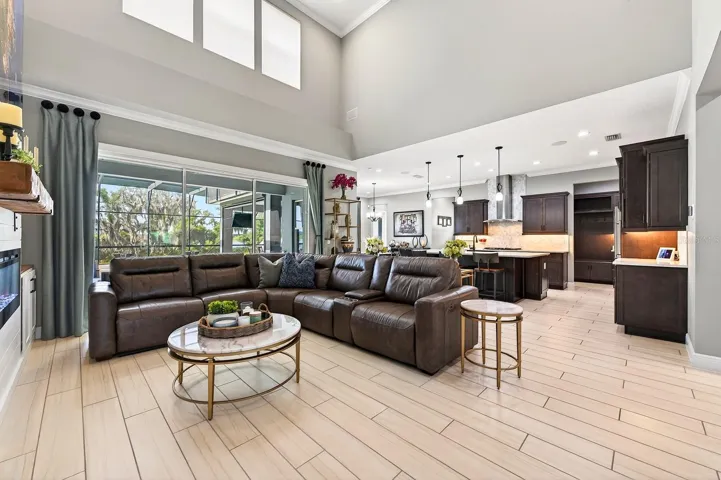 Two story living room is open to your gourmet kitchen.
