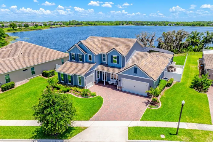 Experience LUXURY ~ WATERFRONT LIVING in this FULLY UPGRADED ~ POOL HOME in the sought-after Highlands at Summerlake Groves community of Horizon West!