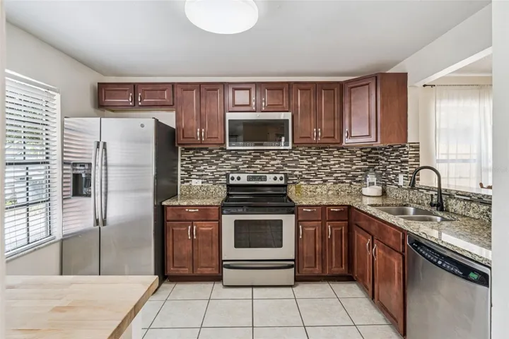 596 Swallow Ct Kitchen with updated cabinets and granite countertops