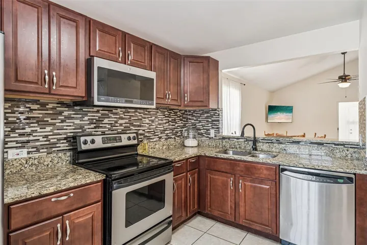 596 Swallow Ct Kitchen with updated cabinets and granite countertops