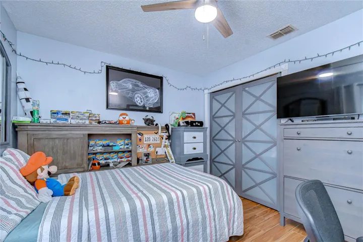 Bedroom 3 with stylish upgraded closet doors.