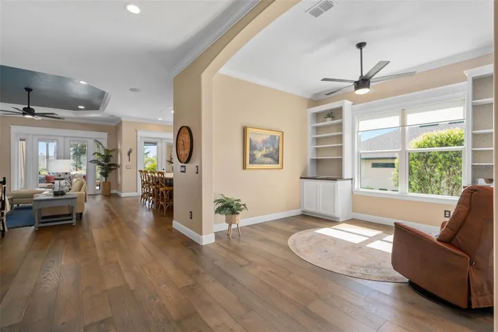 Flex Room/Office and Great Room view. Please take notice of the Custom Woodworking around the Windows, Doors and Built-In's.