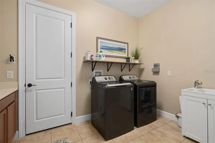 Laundry Room with a Sink and Drop Zone for your convenience.
