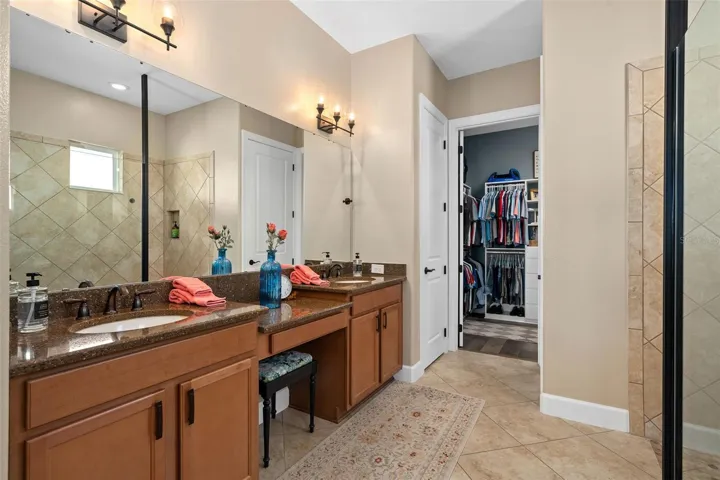 Primary En-Suite featuring Comfort Height Vanity, Oval Undermount Sinks, Linen Closet and a Water Closet