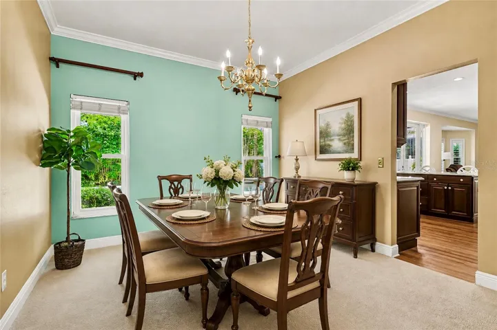 Virtually Staged Dining Room with View of Pool