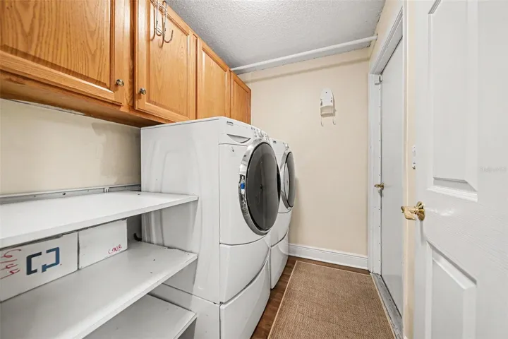 Indoor Laundry with Built-in Cabinets Downstairs