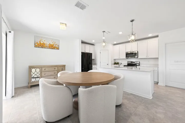 Kitchen is open to the living and dining areas.