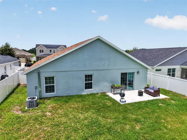 Rear Elevation with Patio, Large Fenced Yard, and Room For a Pool!