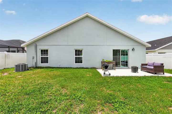 Rear Elevation with Patio, Large Fenced Yard, and Room For a Pool!