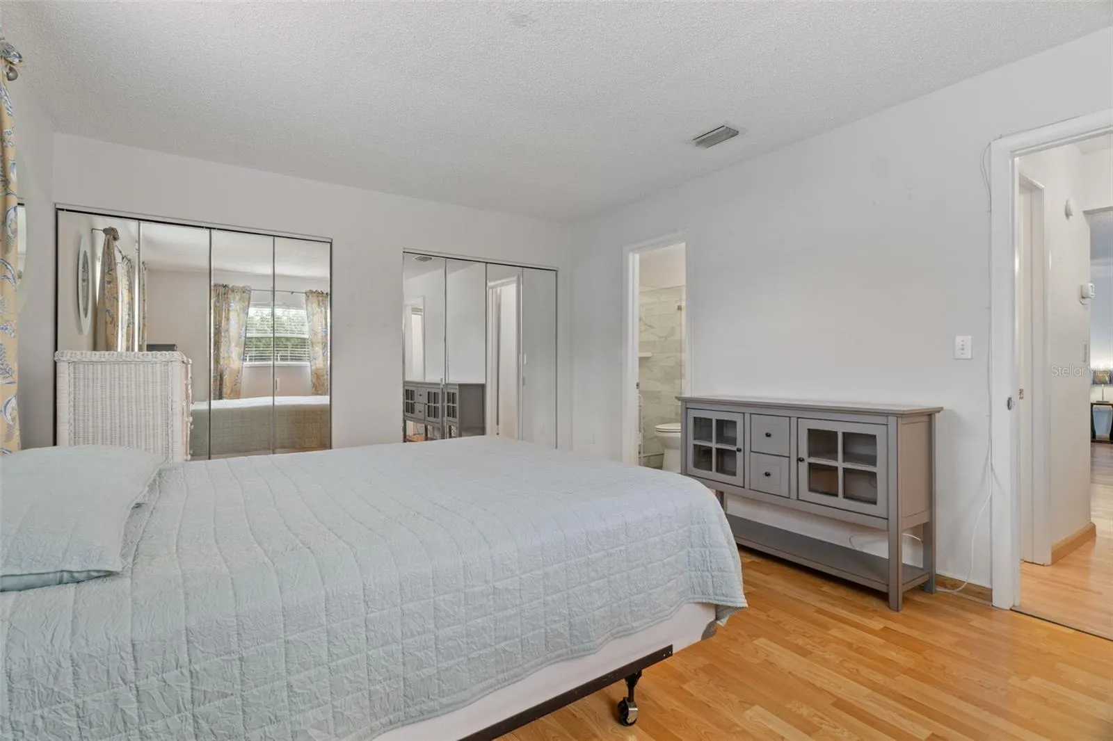 Bedroom with Laminate Floors and Double Closets