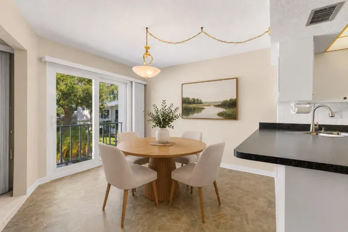Virtual staging. Dining Room with impact sliders to balcony overlook