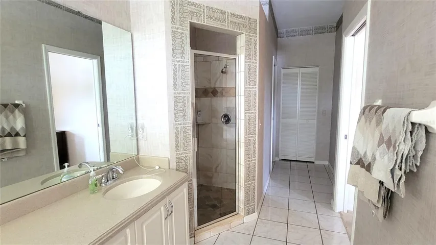 Primary bath shower then hall to private toilet room