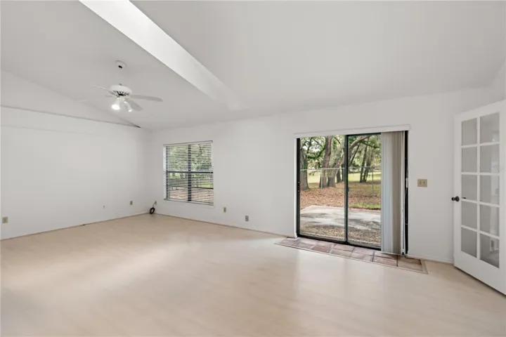 Living/Dining Area with Vaulted Ceiling and Skylight