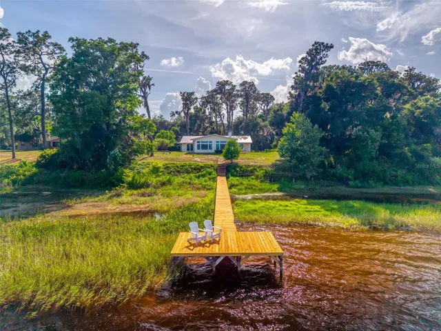 Show Stopping Massive Dock in Lake Dorr from your Beautiful Single Story Lake House!