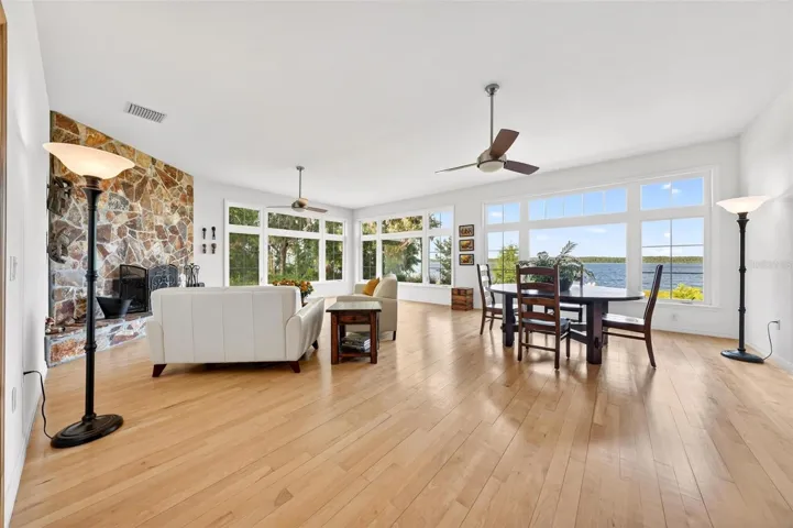 This is lake house living at its best — open, bright, and beautifully connected. From the kitchen to the dining area and beyond, the home is designed so the views, natural light, and peaceful energy of Lake Dorr are always part of the experience.